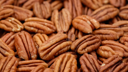 Sticker - raw pecan nuts close up. Healthy food concept