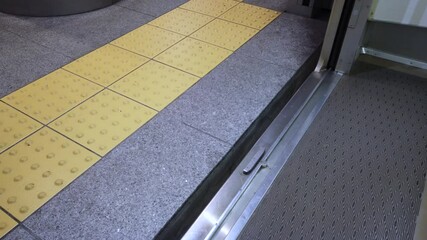 Canvas Print - POV to the floor of closing door of train-subway commuter in slow-motion