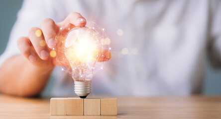 Aufkleber - hand touching on light bulb with connection line. new idea concept with innovation and inspiration, innovative technology in science and communication concept.