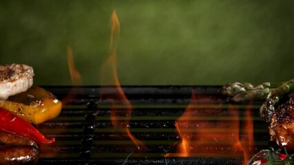 Wall Mural - Super slow motion of mix of meat and vegetable on grill grid. Filmed on high speed camera, 1000 fps