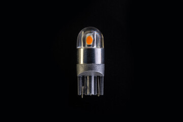 Car light bulb emitting diode, accessories and components for electronics vehicles. copy space. Black background close-up. 12V T10