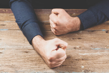 Wall Mural - hits the table with his fist