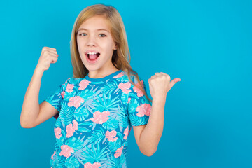 hooray cool beautiful caucasian little girl wearing jeans overall over white background point back e