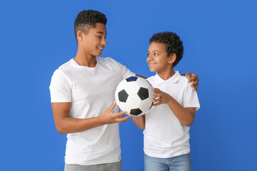 Sticker - African-American boys with ball on color background