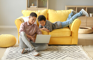 Sticker - African-American boys using laptop at home