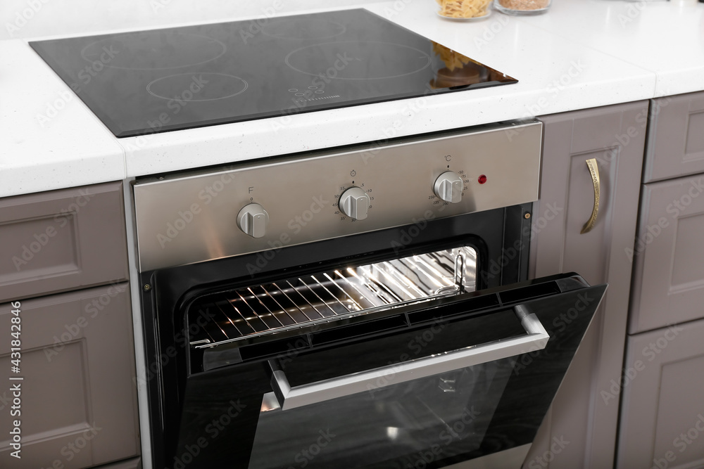 Open oven in modern kitchen
