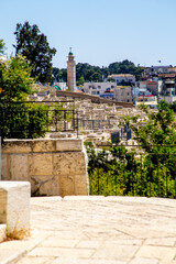 Wall Mural - Jerusalem, Israel-21 april 2021: Perched on ridge just east of Old City, Mount of Olives is location of 3,000-year-old Jewish burial ground with around 150,000 graves and oldest cemetery still in use.