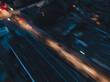 Car driving high speed in city at night. Aerial long exposure photo dark vehicle chase in motion.