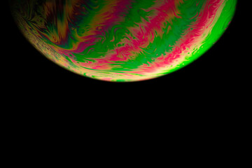 Wall Mural - Abstract background planet. Globe planet earth in galaxy universe space with sun on black background. Abstract colorful soap bubble.