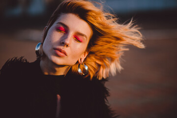 Fashion shot of young hipster woman. Urban street style