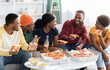 © Prostock-studio - Joyfull african american millennial friends eating pizza