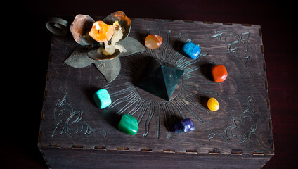 a fortune teller, witch stuff on a table, candles and fortune-telling objects. the concept of divina