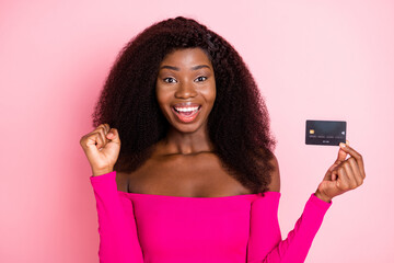 Poster - Photo of nice hooray brunette hairdo lady hold card wear bright top isolated on pink color background