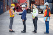 © iammotos - manager wear face mask scanning body temperature and using hand sanitizer alcohol gel to worker before entering working over Containers box at logistic Cargo during Coronavirus or Covid 19 pandemic