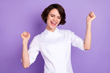 Sticker - Portrait of attractive cheerful girl having fun celebrating good luck isolated over bright violet purple color background