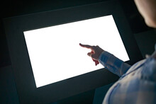 Mockup Image - Woman Touching White Empty Interactive Touchscreen Display Kiosk In Dark Room Of Modern Technology Museum. Mock Up, Template, Copyspace, Education, Futuristic And Technology Concept