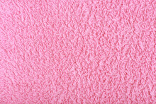 Pink Fuzzy Fabric Close Up. Fleece Cozy Towel Background With Space For Text