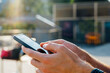 © Boy/Westend61 - Close-up of businessman hand using mobile phone outdoors