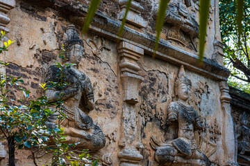 Old Ancient stucco patterns stucco Buddha and angel figures on the outside of the Maha Chedi Wat Chet Yot, seven pagoda temple It is a major tourist attraction in Chiang Mai, Thailand.