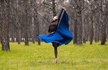 Young Ballet Dancer Spinning While Dancing In Forest