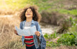 © Jose Carlos Ichiro/Westend61 - Cheerful boy holding map in nature
