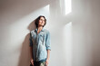 © Robijn Page/Westend61 - Thoughtful woman standing in front of white wall