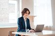 © Robijn Page/Westend61 - Mature businesswoman using laptop on table at home office