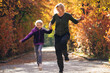© Petra Silie/Westend61 - Happy mother and daughter running in park during autumn