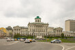 panoramic view of the white historical palace of the Peshkov House and passing cars against the background of a cloudy sky on a spring day. Concept-a famous place in Moscow Russia