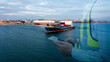 © SHUTTER DIN - Double exposure foreman holding tablet and container ship carrying container in import export business