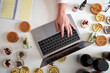 © Veam/Westend61 - Female entrepreneur's hand typing on laptop over table