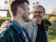 © Gustafsson/Westend61 - Smiling father talking with son outdoors