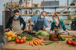 © Mareen Fischinger/Westend61 - Chefs team wearing protective face mask cooking while working together in kitchen
