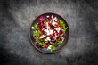 © Larissa Veronesi/Westend61 - Studio shot of plate of vegetarian salad with lentils, arugula, feta cheese, radicchio and bell pepper