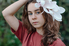 Girl With Blue Eyes Wearing Magnolia Flower In Hair