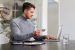 © Daniel Ingold/Westend61 - Businessman paying online through credit card on laptop at office