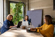 © Javier De La Torre Sebastian/Westend61 - Female colleagues discussing while sitting at conference table in board room