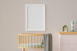 © Elisabeth C√∂lfen/Westend61 - Three dimensional render of blank picture frame hanging on wall over empty crib