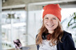 © Jo Kirchherr/Westend61 - Smiling woman with knit hat at home