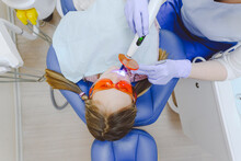 Little Girl Lying In Dentists Chair During Dental Exam