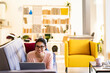 © Giorgio Fochesato/Westend61 - Smiling young woman resting by laptop on sofa at home