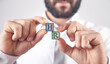 © andranik123 - Man showing HR word on wooden cubes.