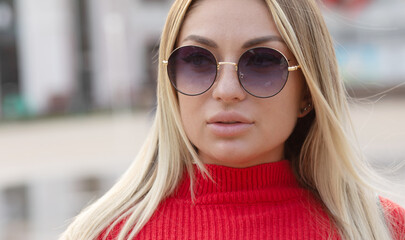 Wall Mural - Beautiful young woman in sunglasses. Outdoor portrait. Summer time.