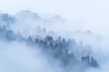 The Chimney Tops, A Very Popular 2-mile Hike For Visitors, Is Unveiled Through Foggy Clouds In The Smoky Mountains.