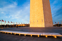 The Washington Monument And American Flags At Sunset On The National Mall, Washington DC.