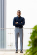 © Ranta Images - Full length shot of confident African businessman outdoors at rooftop