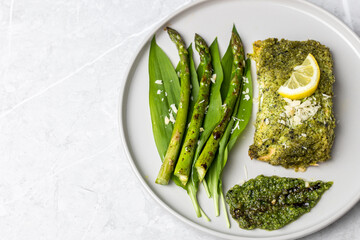 Wall Mural - Salmon fillet with green wild garlic pesto. Green asparagus with salmon