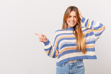 young pretty girl feeling stressed, anxious or scared, with hands on head