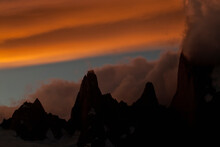 An Incredible Band Of Clouds At Sunset Surround Montt Fitz Roy In Patagonia, Argentina.