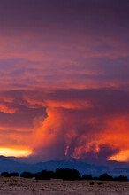 View Of Forest Fires In New Mexico At Sunset, Fires Burning Near Los Alamos Can Be Seen In Distance.